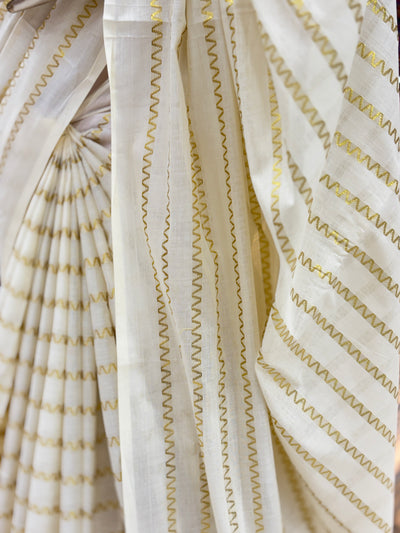 Off-White Cotton Borderless | Set Kerala Kasavu Saree | Zig-Zag Gold Stripes | with Black Tassels on Pallu
