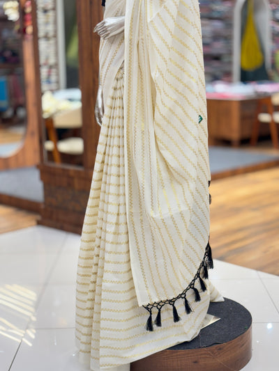 Off-White Cotton Borderless | Set Kerala Kasavu Saree | Zig-Zag Gold Stripes | with Black Tassels on Pallu